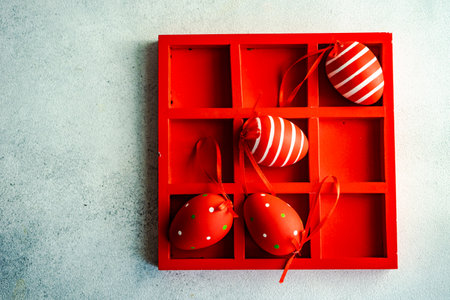 Red wooden box with 3x3 full of red Easter eggsの写真素材
