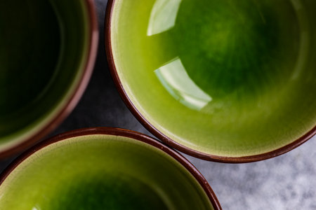 Round geometric green ceramic shapes on concrete backgroundの写真素材