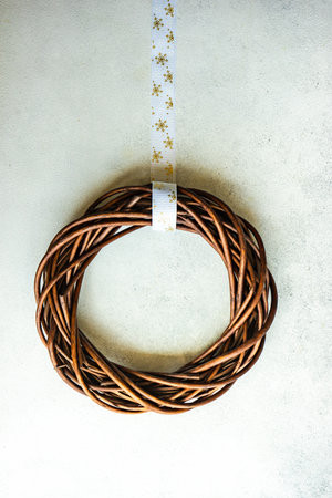 Christmas wreath on concrete background as a holiday card conceptの写真素材