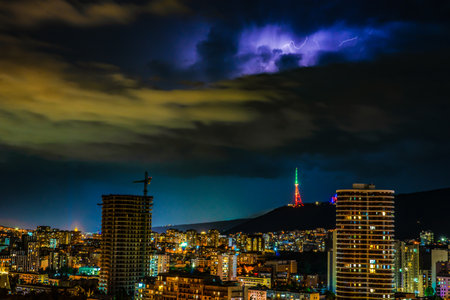 Dramatic evening sky with flashlight during thunder in Tbilisi, Georgia
