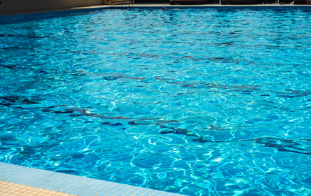 Cool pure blue water in the outdoor pool for relaxing time in summer