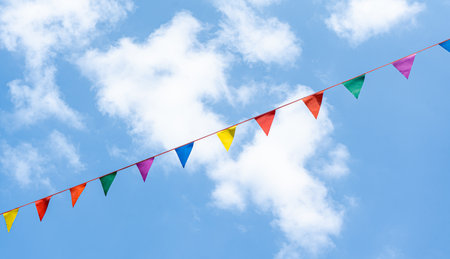 Blue sky with colorful flags in Old Tbilisi, Georgiaの写真素材