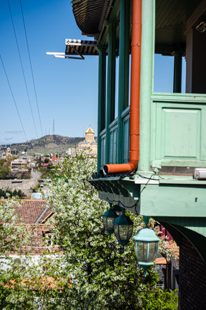 Wooden balcony and Tbilisi's landmark Trinity cathedral