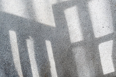 Shadows from the window on concrete wallの写真素材