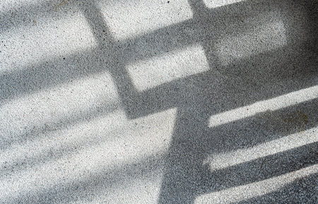 Shadows from the window on concrete wallの写真素材