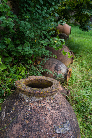 Famous Georgian ancient winemakers pottery known as a kvevry on the territory of Ikalto Academy in Kakheti, Georgiaの写真素材