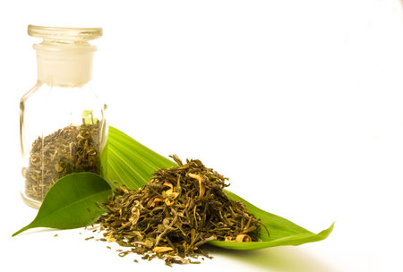 Pharmacy bottle, with herbs. Herbal tea on the leaf.の写真素材