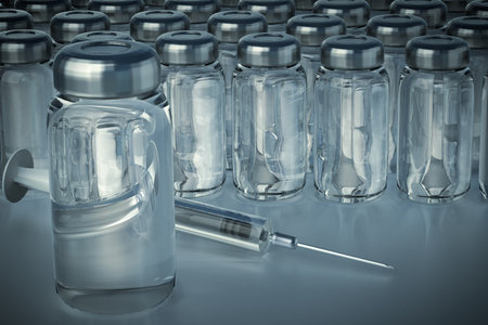 Medical syringe and vaccine bottles.の写真素材