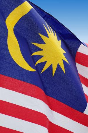 Malaysian flag blowing wind. Close-up. Outdoor shot, postproduction.の写真素材