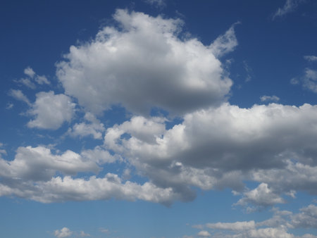 White clouds against blue sky. Nature beautiful background. Deep blue sky and white clouds.の写真素材