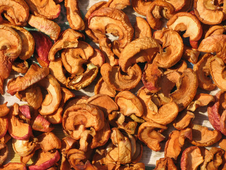 Top view of dried apple slices. The sliced apple are dried in the open air. The concept: vitamins, dried fruits, dietの写真素材