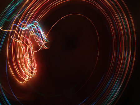 A photo taken by the camera in free flight, Bright colored lines and figures on black. Flyfly. Camera toss imageの写真素材