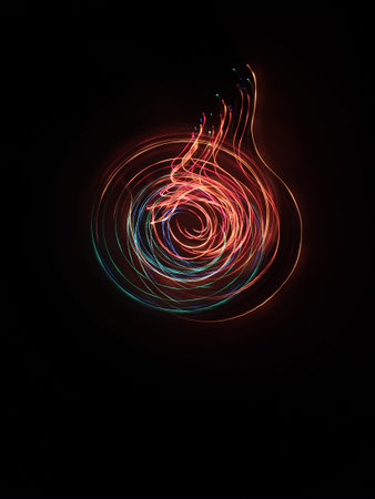 A photo taken by the camera in free flight, Bright colored lines and figures on black. Flyfly. Camera toss image Like electric lampの写真素材