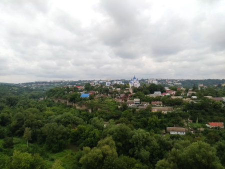 Church with blue dome, dramatic storm, clouds landscape, panoramic view with small details, shot in the city of Kamenets-Podolsky near the fortress, old bricks in foregroundの写真素材