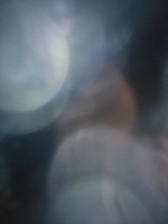 Blur, huge bokeh reflexes, beautiful background, blurred area, background area, background, space for text, gray blue cool hues, designer elementの写真素材