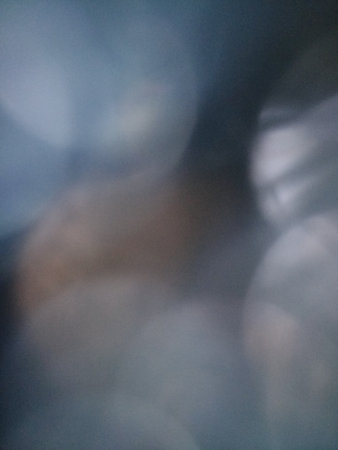 Blur, huge bokeh reflexes, beautiful background, blurred area, background area, background, space for text, gray blue cool hues, designer elementの写真素材