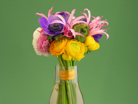 bouquet of flowers in a vase on blurred background, close upの写真素材