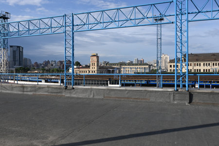 View of Kiev near the railway station. Railway tracks, clock tower, blue sky, summerの写真素材