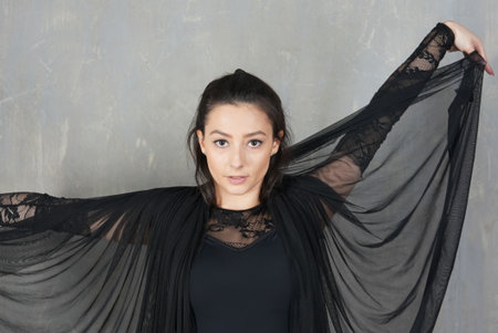 Woman dancer portrait in motion with a semitransparent clothの写真素材