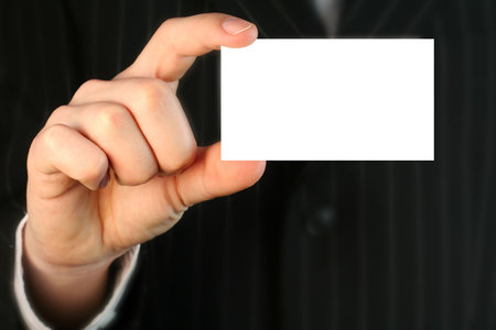 Business man with white cardの写真素材