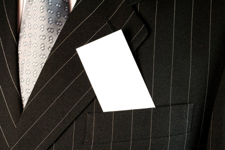 Business man with white cardの写真素材