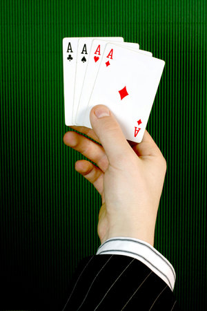 Four ace in a business handの写真素材