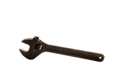 Old adjustable wrench isolated on white