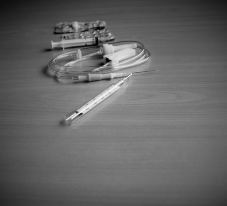 Medical syringe and dropper on the tableの写真素材