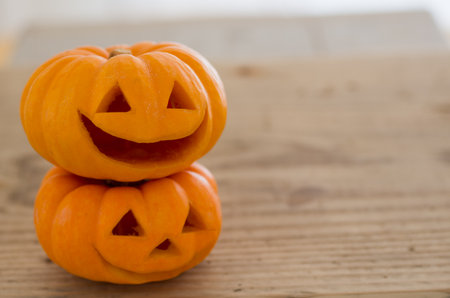 Halloween cute orange pumpkin on an old wooden backgroundの写真素材