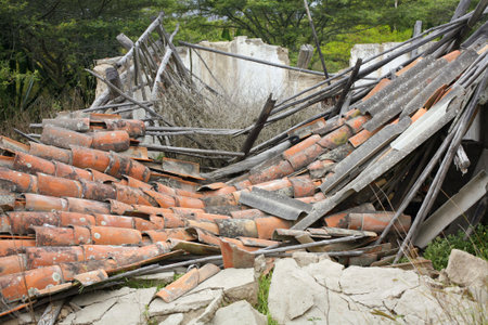 Collapsed house with terra cotta tile roofの写真素材