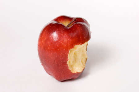 Bitten red Apple, isolated on whiteの写真素材