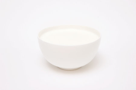 A cup of milk, isolated on whiteの写真素材