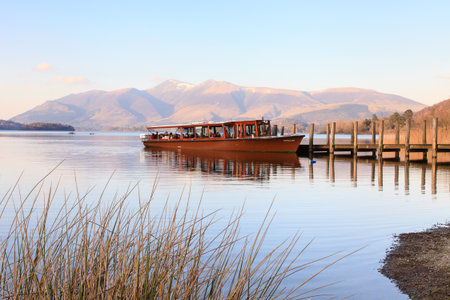 Derwentwater Steamer.  A Derwentwater steamer waits to pick up it's last passengers of the day from Lodore pier in the English Lake District in Derwentwater, England.のeditorial素材
