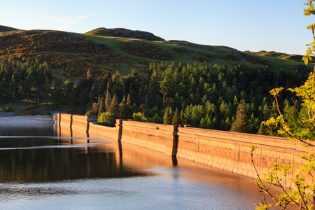 Haweswater Dam.  Haweswater reservoir and dam lie in the English Lake District National Park.  Construction of the dam began in 1929 and the reservoir now supplies water to the city of Manchester.の写真素材
