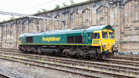 Freightliner Train.  A class 66 Freightliner train pictured at Carlisle Citadel station in Cumbria.  Freightliner is a multinational rail freight and logistics company.のeditorial素材