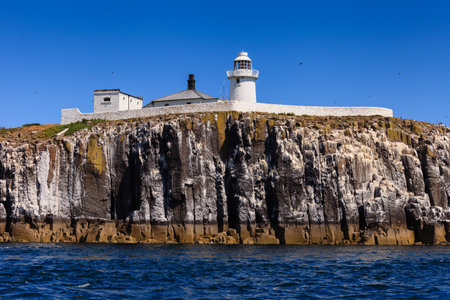 Farne Islands Lighthouse.  This lighthouse is situated on the Inner Farne Islands on the Northumberland Coast in Northern England.の写真素材
