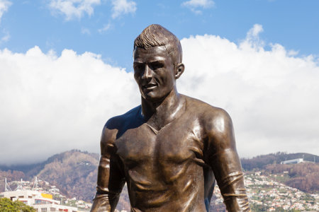 A statue of footballer Christiano Ronaldo is pictured on the Funchal waterfront on the Portuguese island of Madeira.のeditorial素材