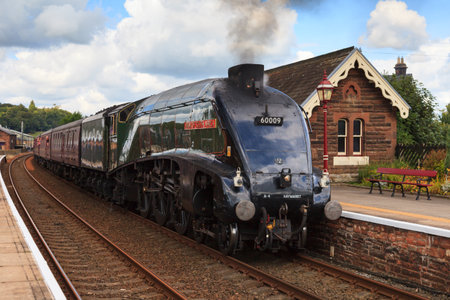 Preserved steam locomotive, Union of South Africa, heads the Cumbrian Mountain Express through Lazonby station, on the Settle to Carlisle railway.のeditorial素材