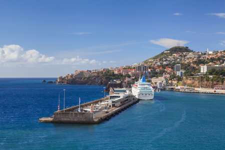 The harbour in Funchal on the Portuguese island of Madeira.  Cruise ship Thomson Majesty can be seen docked in the harbour.のeditorial素材