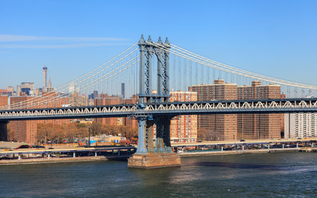 A view of Manhattan Bridge in New York City.  The bridge spans the East River connecting the...