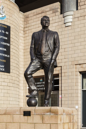 A statue of Bobby Robson outside St James' Park in England celebrating his contribution to Newcastle United Football Club.のeditorial素材