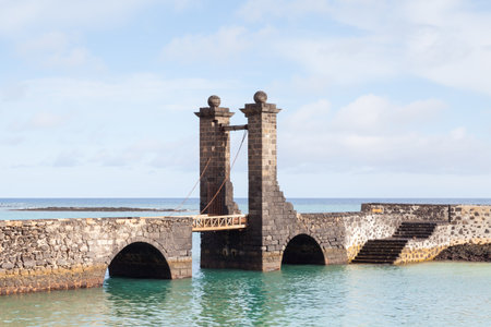 Bridge of the Balls.  Puente de las Bolas leads to San Gabriel Castle in the port city of Arrecife on the Spanish island of Lanzarote.のeditorial素材
