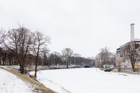 A winter view along a frozen Riga canal.  The canal flows through Bastion Hill park in Riga, Latvia.のeditorial素材