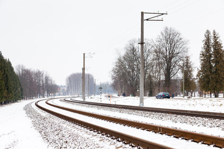 The view along a snow covered railway track in Sigulda, Latvia.のeditorial素材