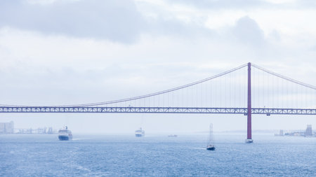 River Tagus.  Ships and boats traverse the River Tagus beside the port of Lisbon in Portugal.