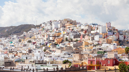 The view across the city of Las Palmas towards the painted hillside on the Spanish island of Gran...