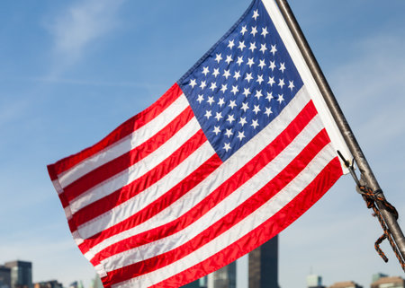 An American flag flies from a boat on the East River in New York City.の写真素材