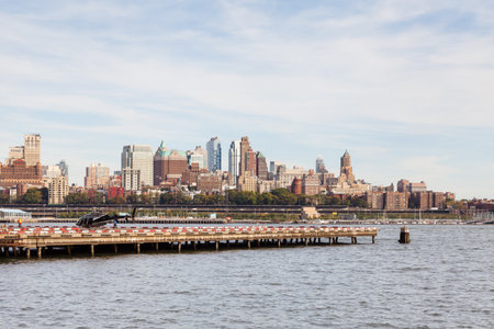 Manhattan heliport in New York City.  In the background beyond the East River is the Brooklyn...