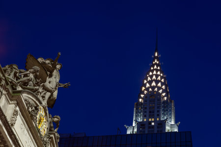 A night time view of The Glory of Commerce sculpture adorning Grand Central Station, New York City. ...