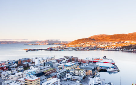 The view across the Hammerfest skyline as a Hurtigruten ship is seen docked in the port.  Hammerfest is a town on the island of Kvaloya, Norway.のeditorial素材